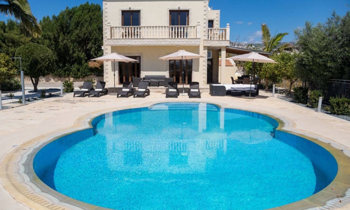 Peyia Town House | A 3 bedroom villa in a private gateway with a large swimming pool with stunning sea views