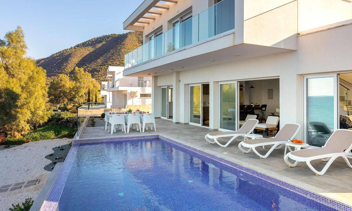 Pachyammos House | This stunning villa is modern and contemporary and has a wonderful location on the seafront in the v