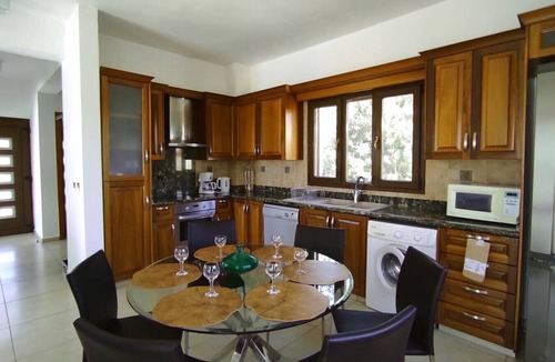 Peyia Town House | A 3 bedroom villa in a private gateway with a large swimming pool with stunning sea views