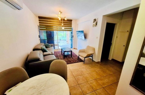 Universal Apartment | A spacious apartment with one bedroom and a living room.