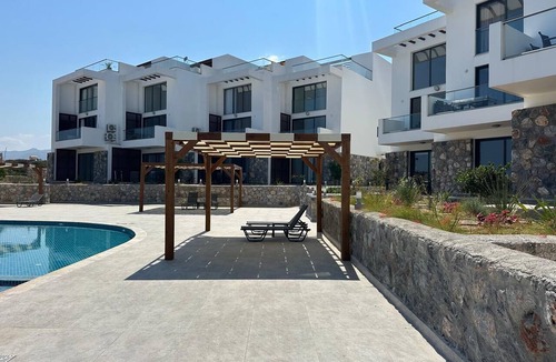 Kucukerenkoy Apartment | "Azure Pearl" - Wake Up by the Sea · Oceanfront Garden Retreat with Pool
