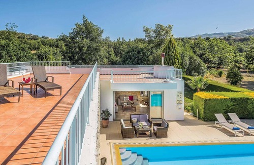 Giolou House | Situated in the inland region of Miliou, this stylish villa (which is next door to its sister villa