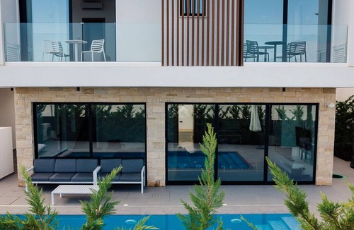 Cape Greko Villa | Villa Ektoras at Periyiali Resort with modern design, and amenities.