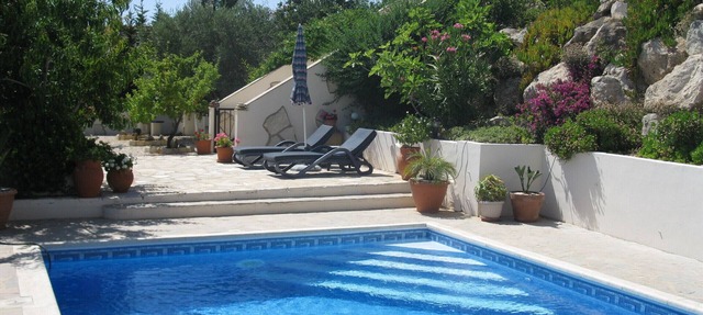 A hillside retreat with a large pool and set in extensive gardens in Tsada