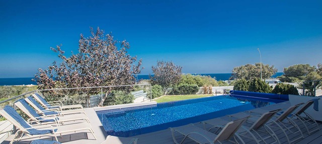 Picture Relaxing Beside Your Private Pool in Protaras Reading Your Favourite Book in Protaras