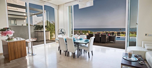 Picture Relaxing Beside Your Private Pool in Protaras Reading Your Favourite Book in Protaras