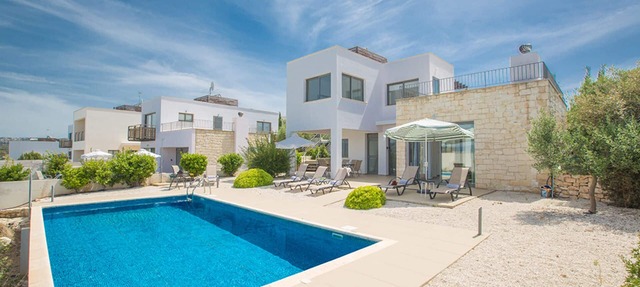 Picture Relaxing Beside Your Private Pool in Your Villa Reading Your Favourite Book in Paphos