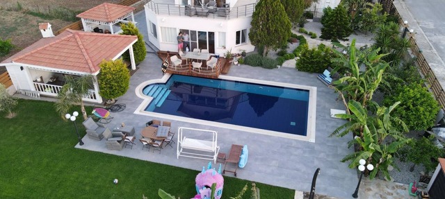 Seafront Villa with large swimming pool with sea and mountain views. in Çatalköy