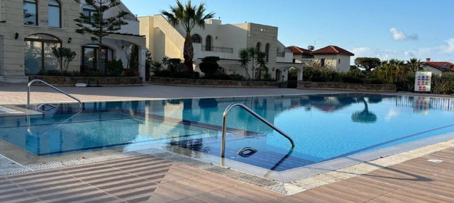Sunny corner villa in North Cyprus right by the sea in Tirmen