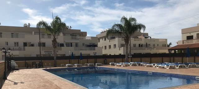 Two bedroom ground floor apartment with large communal pool in relaxing location in Liopetri