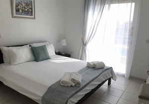 Modern pool facing apartment in popular Limnaria Gardens in Paphos