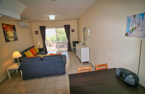 Peyia Town House | Direct access to the pool from the garden. A sandy beach is a few minutes away.