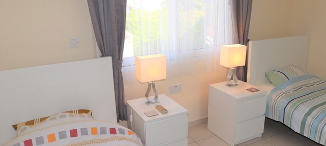 Direct access to the pool from the garden. A sandy beach is a few minutes away. in Peyia